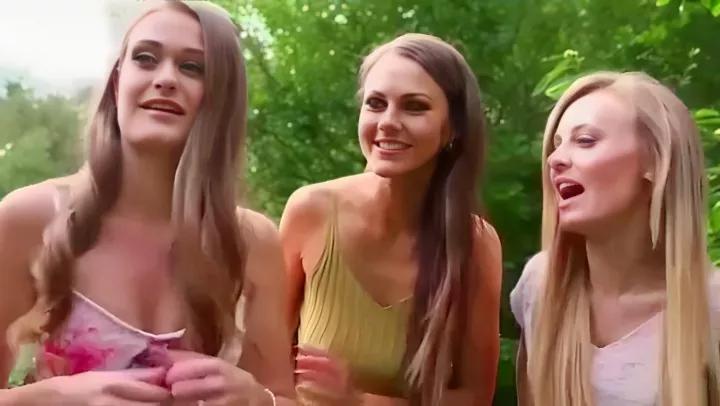 Three young hotties jerking off a dick on the beach 
