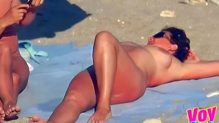 Peeping at naked nudists on the beach 